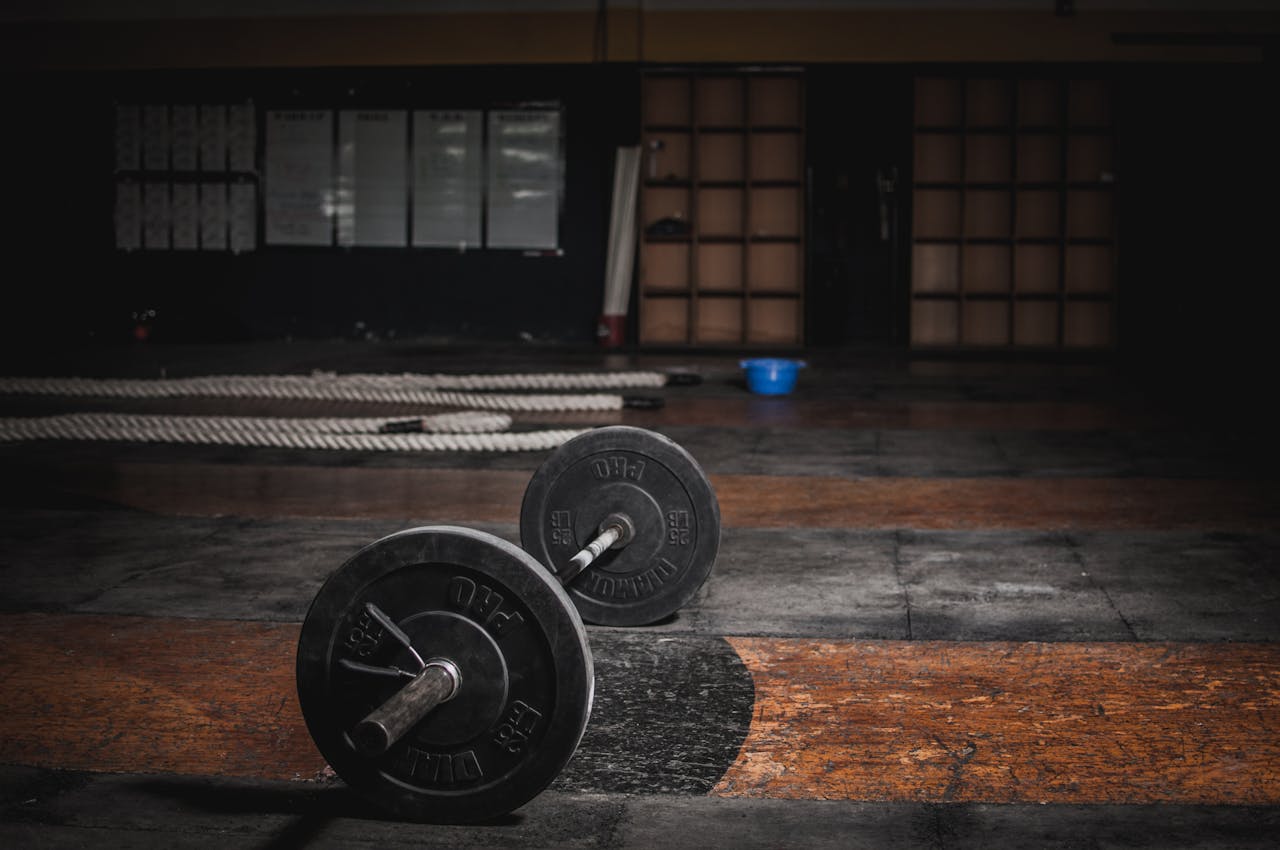 a barbell on the floor of a gym